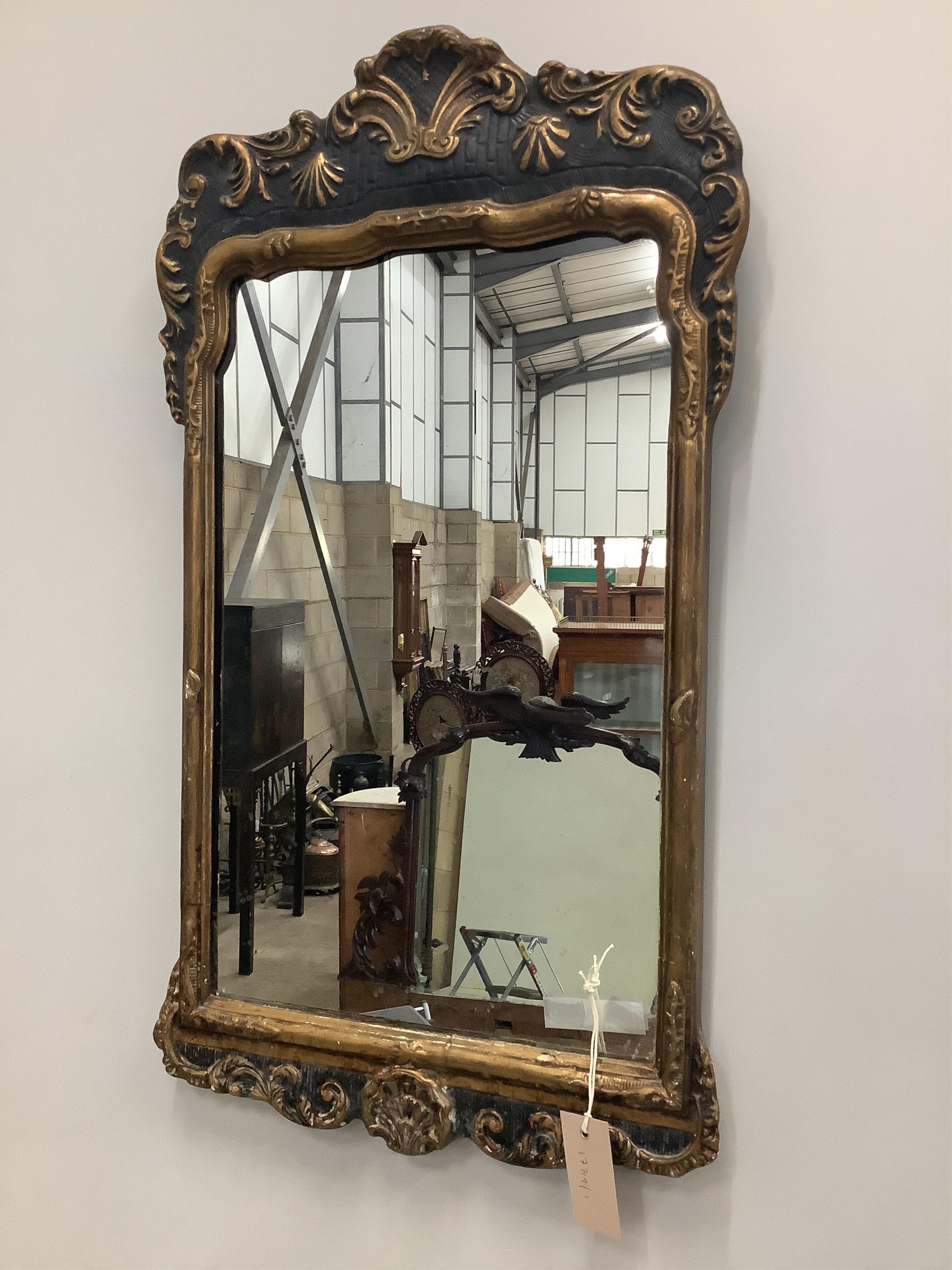 An 18th century style gilt composition wall mirror, width 40cm, height 70cm. Condition - fair